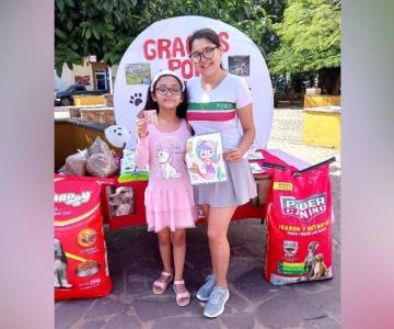 Niña intercambia dibujos por croquetas para ayudar a animales de la calle