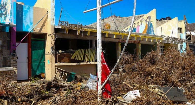 Destruidos pero felices, comerciantes ponen buena cara a la tragedia