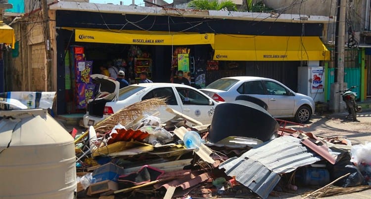 Destruidos pero felices, comerciantes ponen buena cara a la tragedia