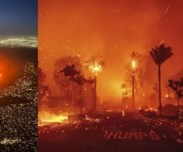 Fuerte incendio forestal azota Los Ángeles; evacúan a 30 mil personas