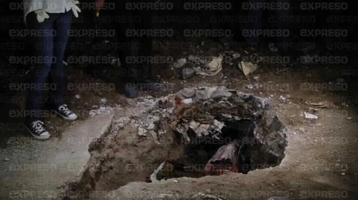 Encuentran cuerpo enterrado en casa